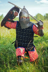 A medieval Central Asian warrior, a nomad in 14th-century armor, stands in a defensive or attacking...