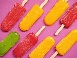 Colored fruit ice cream made from kiwi, lemon and berries