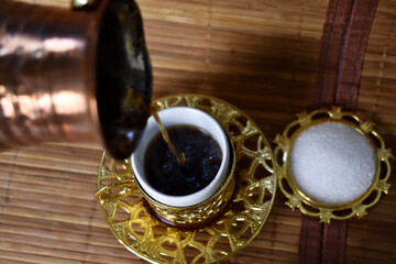 hot coffee poured into a cup