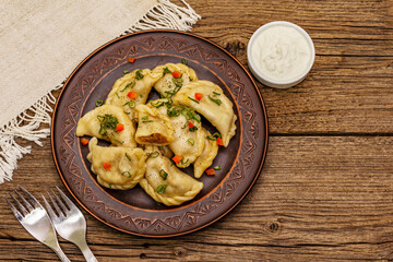 Dumplings stuffed stewed cabbage and sour cream. Traditional Ukrainian dish varenyky
