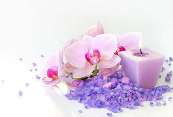 Composition of spa treatment: Orchids and sea salt with candle