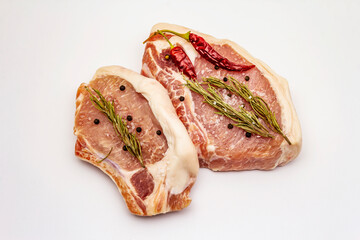 Raw pork steaks isolated on white background