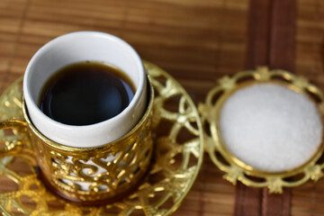 cup of coffee and a cup of sugar