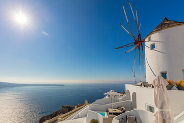 Famouswhite windmill on Santorini island, travel in Greece