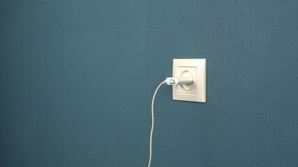 Charger mobile device is inserted into the socket