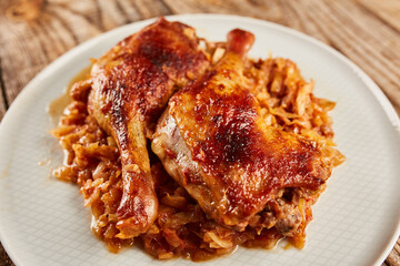 Roasted duck legs on cabbage