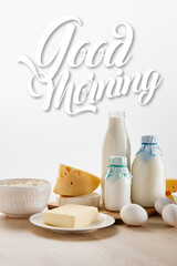 various fresh organic dairy products and eggs on wooden table isolated on white, good morning illustration