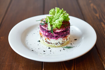 A white plate topped with a piece of cake on a table