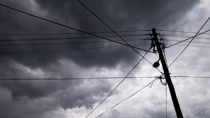 Utility pole and stormy sky 