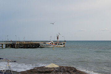 Yacht near the pier in the sea, coast