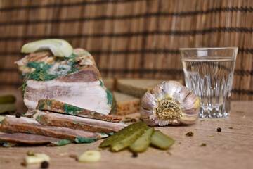 two glasses of vodka and an appetizer