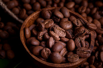 Roasted coffee beans on black background, coffee background