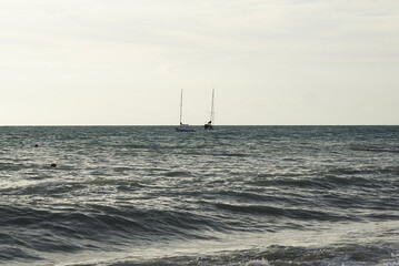 Yacht on the high seas, coast