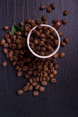 Roasted coffee beans on black background, coffee background