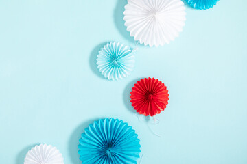 4th of July American Independence Day. Happy Independence Day. Red, blue and white star confetti, paper decorations on blue background. Flat lay, top view, copy space