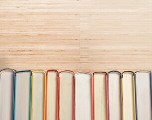 Collection of old books on wooden background