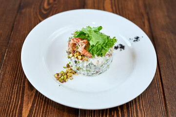 A plate of food sitting on top of a wooden table