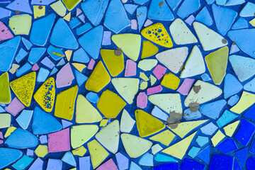 Fototapeta na wymiar multi colorful stone mosaic tiles on the wall as background or texture,mosaic background