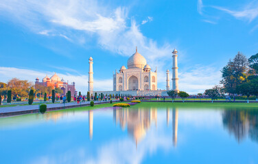Fototapeta na wymiar Taj Mahal at sunset with reflection on water at sunset - Agra, India