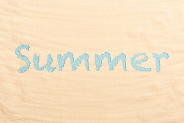 Blue letters summer on a beach sand. Flat lay, top view