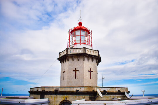 Bright colourful photo of a famous light house on Azorean island, San Miguel island attraction