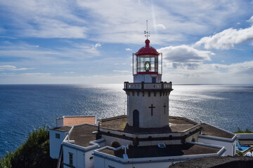 Bright colourful photo of a famous light house on Azorean island, San Miguel island attraction
