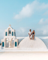 A couple, a bride and groom at Santorini Greece before their wedding.