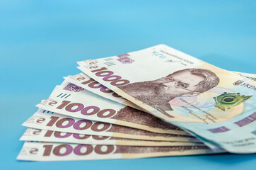 UAH. Money of Ukraine 1000 hryvnia, Ukrainian banknote isolated on blue background