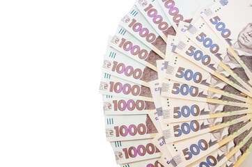 new 1000 and 500 hryvnia isolated on a white background. A lot of hryvnia. Close-up. Copy space. Place for text.
