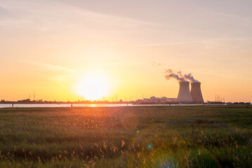 Fototapeta na wymiar Sunset over the nuclear reactor of Doel in the Port of Antwerp, Belgium.