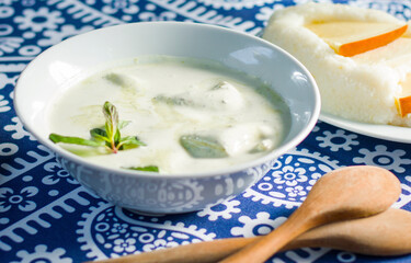 Georgian traditional food Gebjalia, cheese in milk and greens, species.