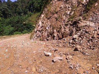 Small Rocks fall near the road