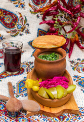 Georgian traditional food Lobio or kidney and haricot beans soup with picked vegetables and red wine.