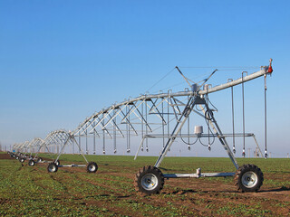 Irrigation system on wheels on the field
