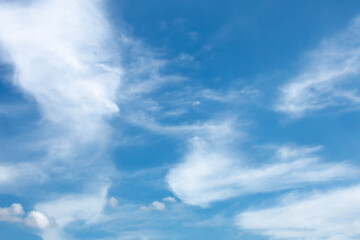 Naklejka na ściany i meble White clouds in the clear blue sky at dawn