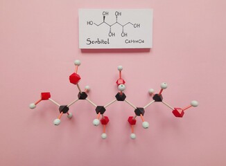 Molecular structure model and structural chemical formula of sorbitol molecule - a sugar alcohol...