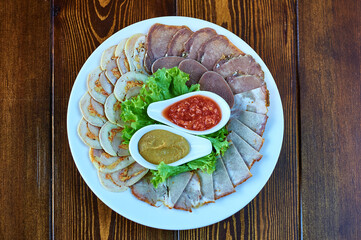 A plate of food sitting on top of a wooden table