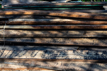 a pile of old wooden planks