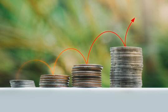 Image Of The Concept Of Increasing Money With A Red Line Graph And Arrow Showing A Gradual Increase In Revenue.