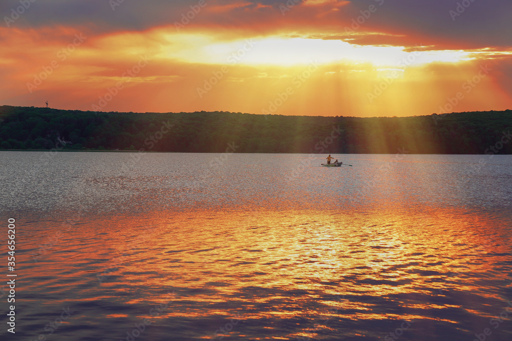 Wall mural sunset by the river. panorama. fishing village