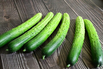 fresh cucumbers on a wooden table