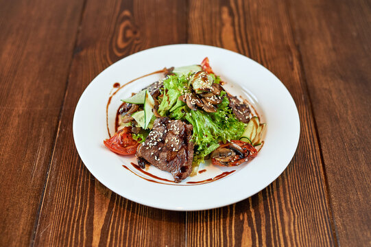 A plate of food sitting on top of a wooden table