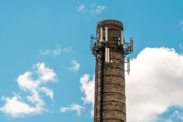 Old  brick chimney with mobile phone antennas