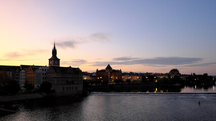 Vltava embankment at sunrise. Old Prague architecture at dusk.