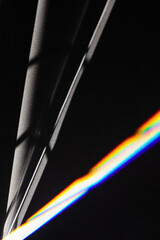 Black futuristic shadows and bright light refraction glow effect with colorful rainbow. Black noir...