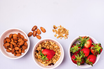 Bowls with Granola or Muesli Bowl with Strawberry and Almond Healthy Diet Breakfast Top View Flat Lay Horizontal