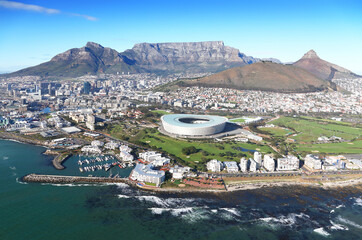 Obraz premium Cape Town, Western Cape / South Africa - 06/07/2019 - Aerial photo of Cape Town CBD, V&A Waterfront, Cape Town Stadium with Table Mountain in the background