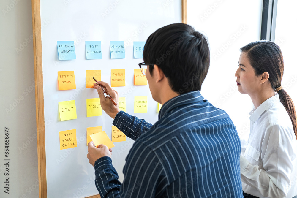Poster two creative business people meeting and planning use notes sticky note on white board to share idea