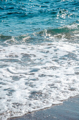 Fototapeta premium Seascape background white waves on blue sea