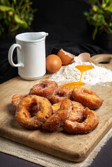 Handmade doughnuts with sugar, ingredients for elaboration